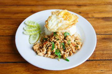 Thai spicy food basil chicken fried rice recipe with fried egg (