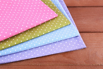 Colorful napkins on wooden table