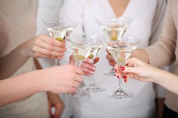 Woman hands with glasses of martini close-up