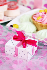 Cute gift on birthday table close-up