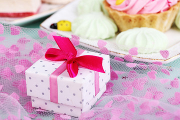 Fototapeta na wymiar Cute gift on birthday table close-up