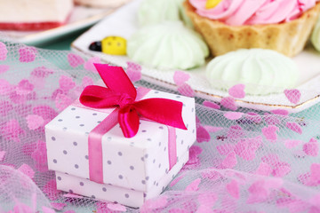 Cute gift on birthday table close-up