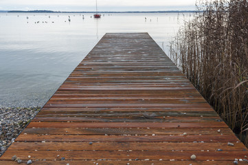 Fototapeta premium Lake Garda wood pier at winter