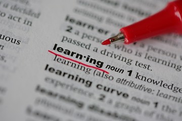 Underlined LEARNING word on a page of a dictionary