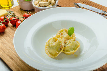 Homemade tortellini stuffed with spinach and garlic