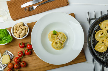 Homemade tortellini stuffed with spinach and garlic
