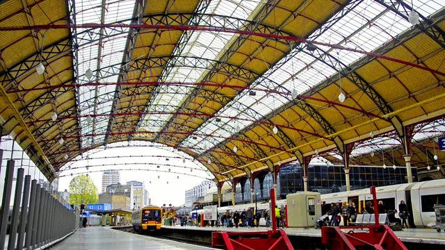 Modern train leaves the Victoria railway station in London