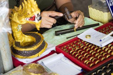 goldsmith use a hammer and nail to carve the tracery