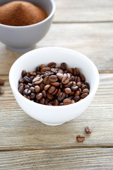Whole and Grinded grains of black coffee