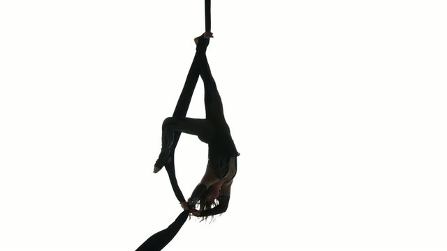 Woman dancer on aerial silk, aerial contortion, aerial ribbons,
