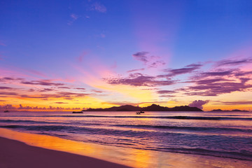 Naklejka na ściany i meble Sunset on tropical beach - Seychelles