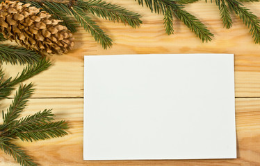 The spruce branches on a wooden board