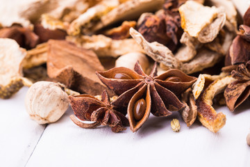 Different spices on the white board.