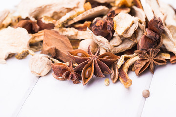 Different spices on the white board.