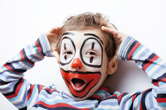 little cute boy with facepaint like clown, pantomimic