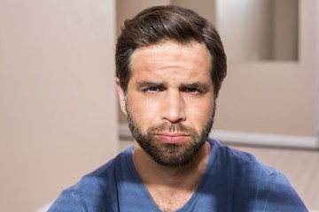 Obraz premium Depressed man sitting on floor