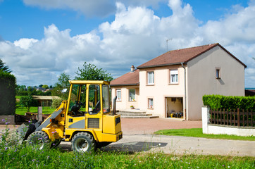 Obraz premium tractor near house
