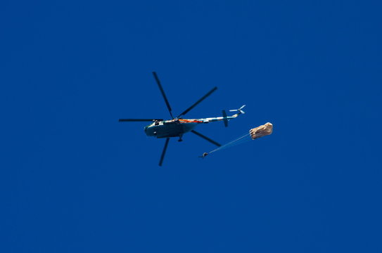 Helicopter and the parachutist