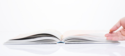 hand opening the book on white background