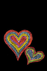 Conceptual image of love, with two vivid color shape hearts