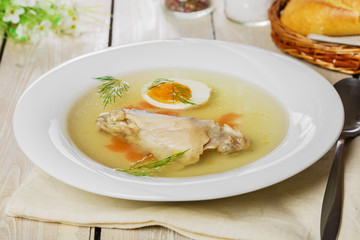 chicken broth with meat and boiled egg