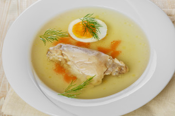 chicken broth with meat and boiled egg