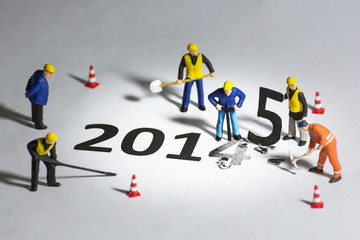 Miniature engineer  change represents the new year 2014- 2015