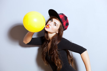 Closeup fashion studio portrait of hipster young girl