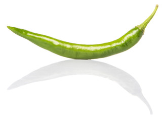 Green chili peppers over white background