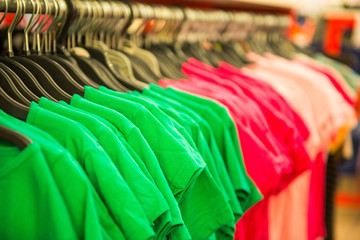 rows of cotton T-shirts in a large store