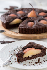 chocolate pear pie on white table