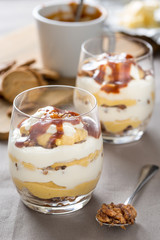 layered sweet dessert with caramel in glass