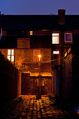 Dark inner city cobblestoned back alley