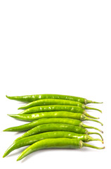 Green chili peppers over white background