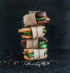 Foto op Canvas Cured chicken and spinack whole grain sandwich tower with spices © sonyakamoz