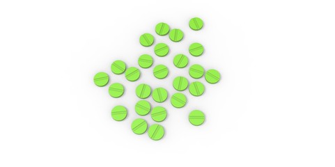 green drugs pills on white background