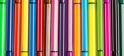 Set of multi-colored ball pens background