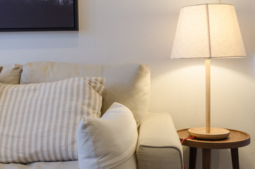 earth tone color sofa with lamp