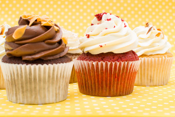 Cupcakes on yellow background