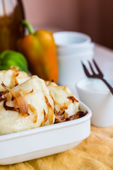 dumplings with potatoes, fried onions and sour cream, Ukrainian