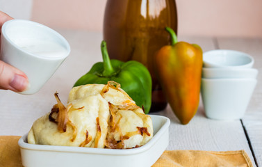 dumplings with potatoes, fried onions and sour cream, Ukrainian