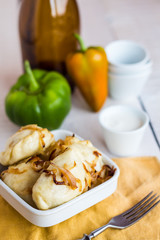 dumplings with potatoes, fried onions and sour cream, Ukrainian