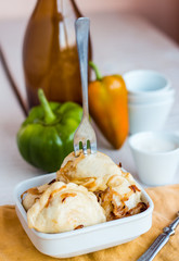 Fork dumplings with potatoes, fried onions and sour cream, Ukrai
