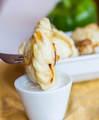 dumplings with potatoes in cream sauce, fried onions, Ukrainian