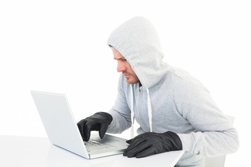 Hacker using laptop to steal identity