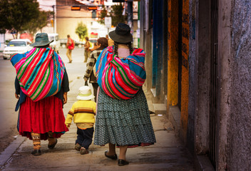 Bolivian people in city - obrazy, fototapety, plakaty