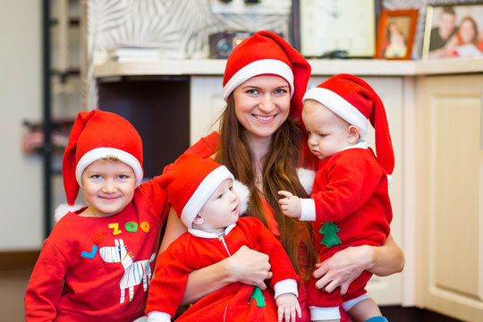 Mother with kids, baby Santas