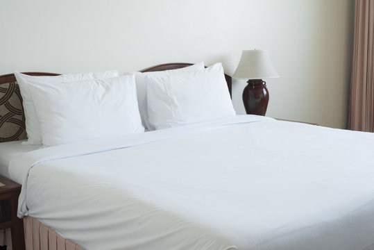 Empty bed in bedroom.