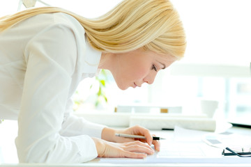 Young female architect at office