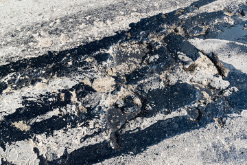 Road repair. Hole in  asphalt and bitumen